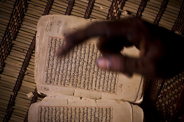 a local guide shows some of old tablets part of the 'Ahmed al Mahmoud fondation' library in Chuinguetti. Some of the manuscripts date back to the 9th century up to the 20th.